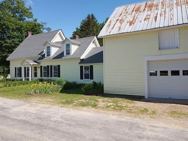 view of side of property featuring a garage