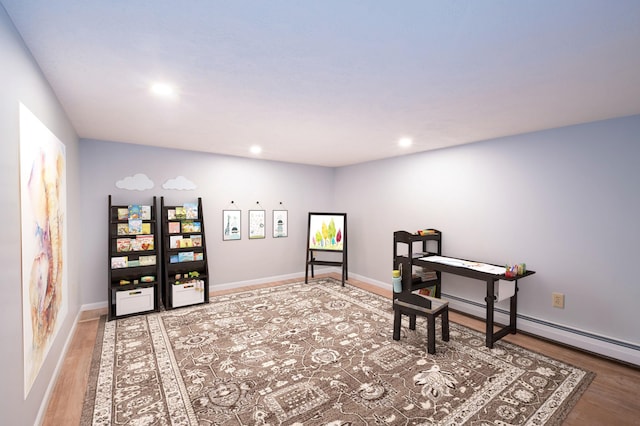 sitting room featuring recessed lighting, baseboards, and wood finished floors