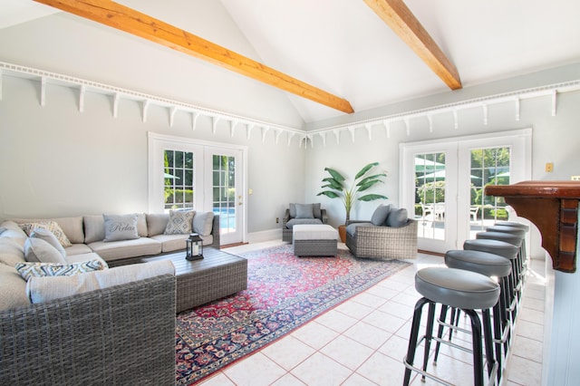 living area with high vaulted ceiling, baseboards, french doors, beam ceiling, and tile patterned floors