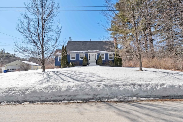 new england style home featuring a garage