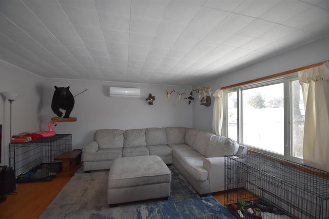 living room with wood finished floors and a wall mounted air conditioner