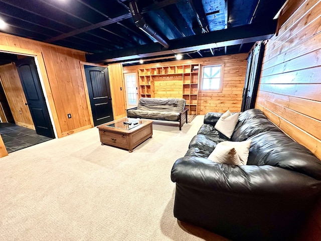 carpeted cinema room with wooden walls