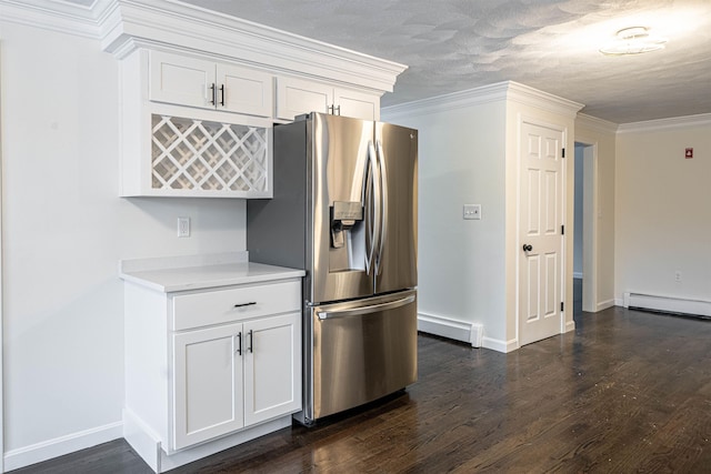 kitchen with a baseboard radiator, dark wood-style floors, stainless steel fridge, and ornamental molding