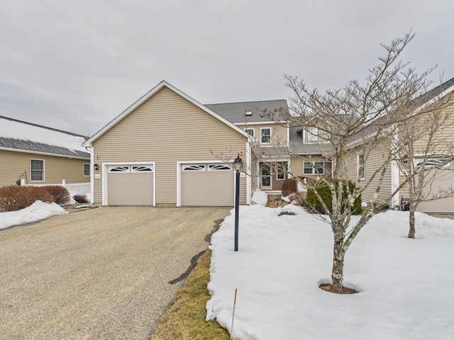 view of front of property with an attached garage and aphalt driveway