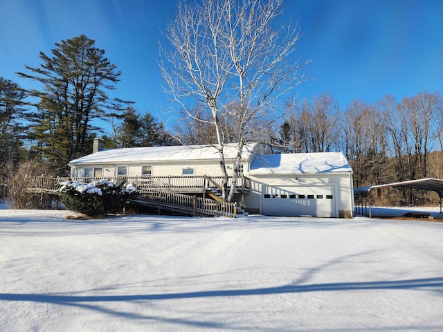 view of front of property with a garage and a chimney