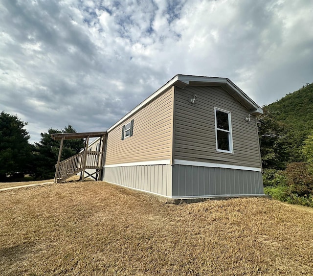 view of side of home featuring a yard