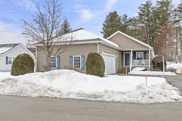 ranch-style house with an attached garage and covered porch