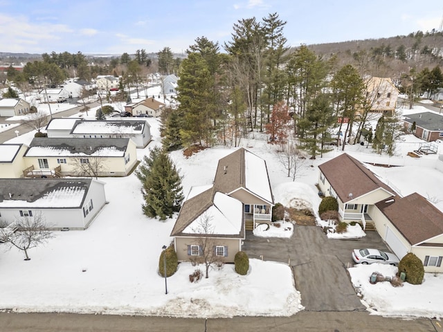 snowy aerial view featuring a residential view