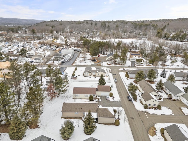 snowy aerial view featuring a residential view