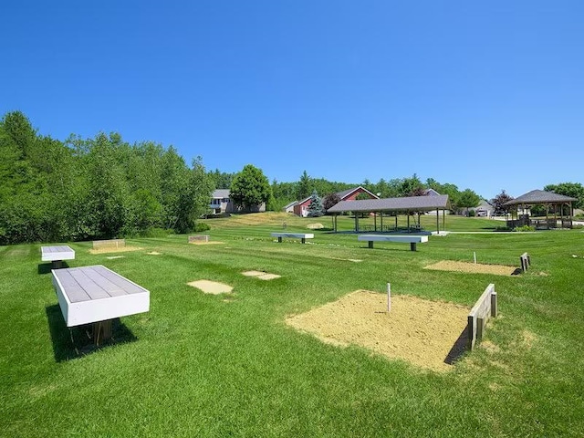 view of community featuring a yard and a gazebo