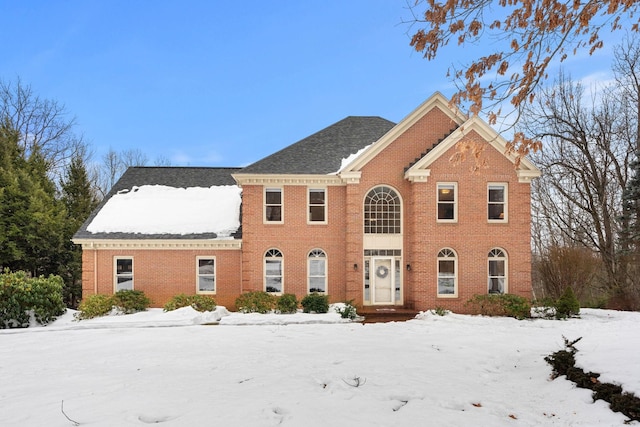 view of front of home featuring brick siding