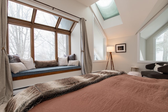 bedroom featuring vaulted ceiling with skylight