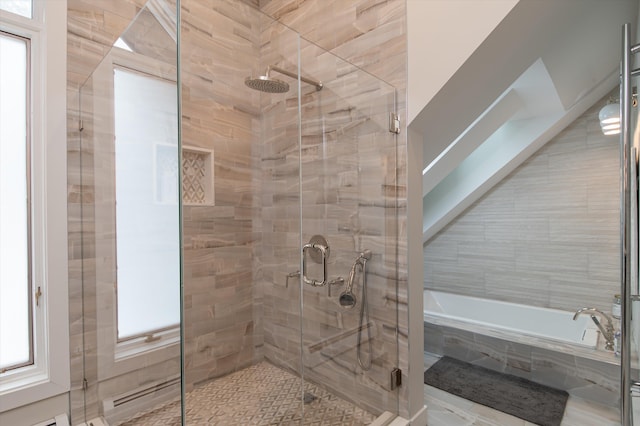 bathroom with a garden tub and a stall shower