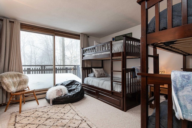 carpeted bedroom featuring a textured ceiling