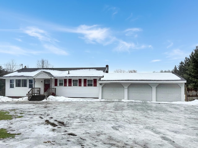 single story home featuring a garage