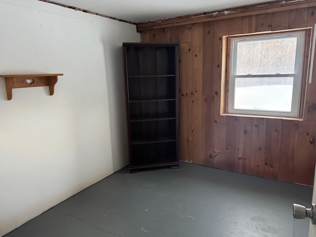 unfurnished room featuring finished concrete flooring