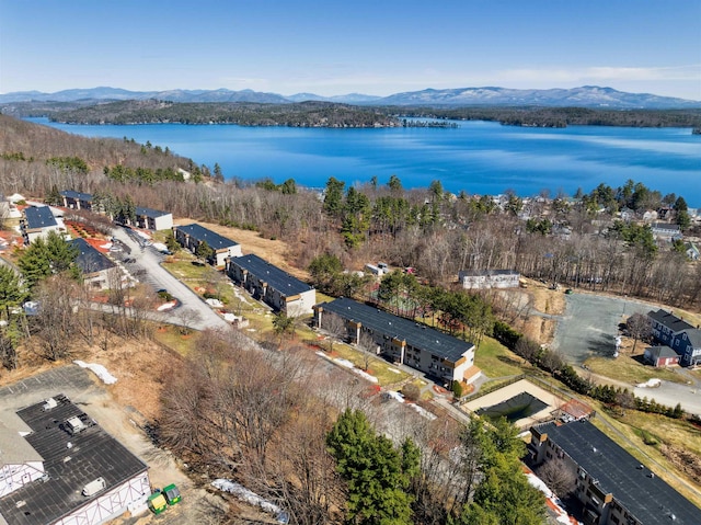 drone / aerial view featuring a water and mountain view