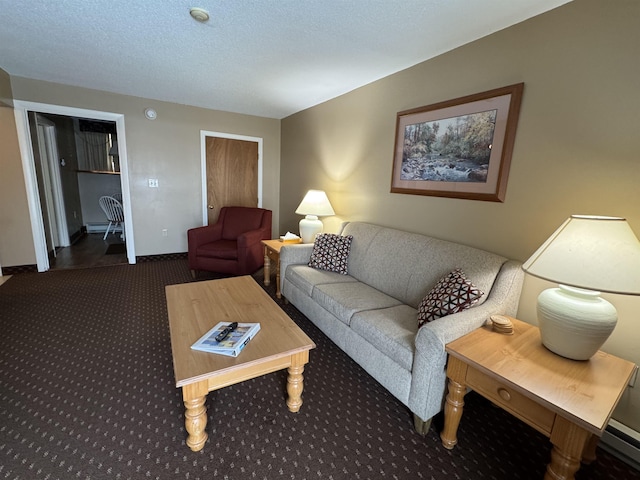 living area with a textured ceiling, baseboards, and carpet flooring