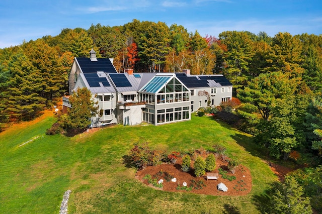 aerial view featuring a wooded view