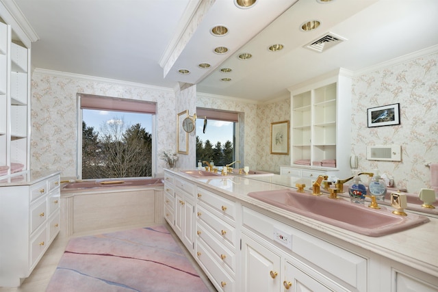 bathroom featuring wallpapered walls, a sink, visible vents, double vanity, and crown molding