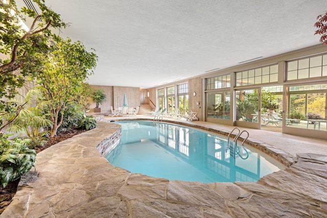 view of pool featuring a patio and fence