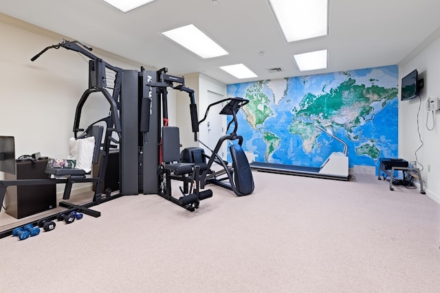 exercise room featuring carpet floors and visible vents