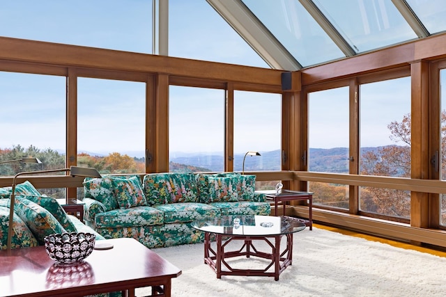 sunroom / solarium with vaulted ceiling and a mountain view