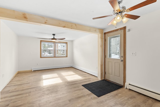 foyer featuring a baseboard radiator, wood finished floors, a ceiling fan, and baseboards