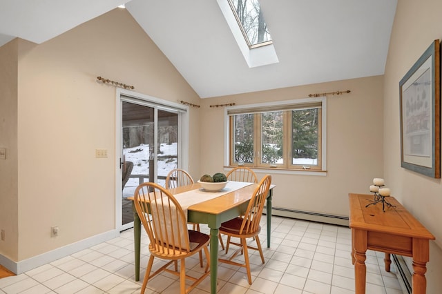 dining room with a baseboard heating unit, light tile patterned floors, vaulted ceiling, and baseboards