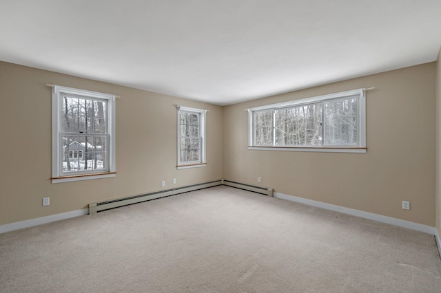 unfurnished room featuring a wealth of natural light, a baseboard radiator, and carpet flooring