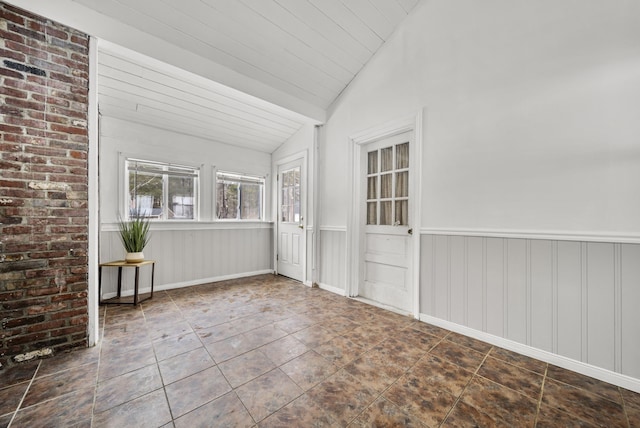 unfurnished sunroom with lofted ceiling