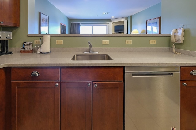 kitchen with a sink, visible vents, light countertops, and stainless steel dishwasher