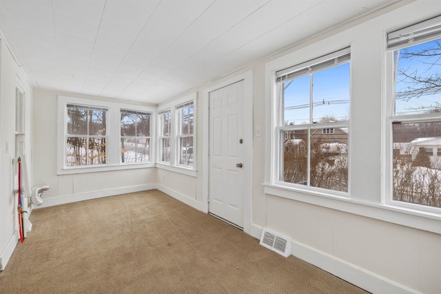 unfurnished sunroom with visible vents