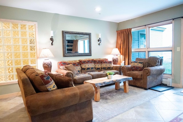 living area featuring baseboard heating and baseboards