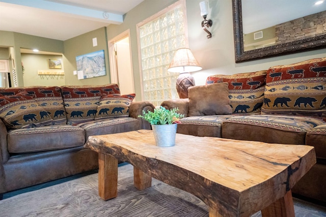 living room with beam ceiling