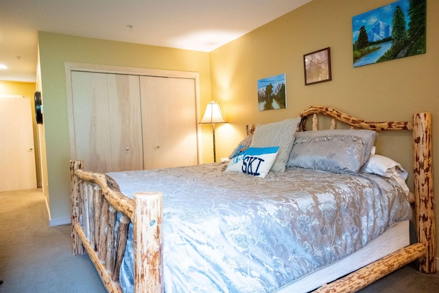 carpeted bedroom with a closet