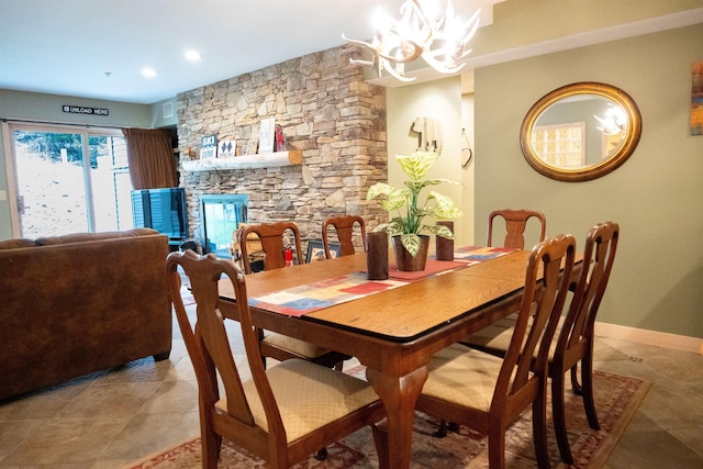 dining space with light tile patterned floors, baseboards, and a chandelier