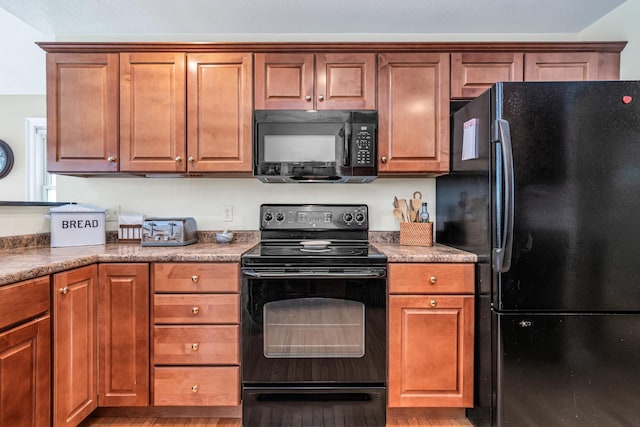 kitchen with brown cabinets and black appliances