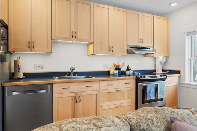 kitchen featuring light brown cabinets, recessed lighting, under cabinet range hood, a sink, and appliances with stainless steel finishes