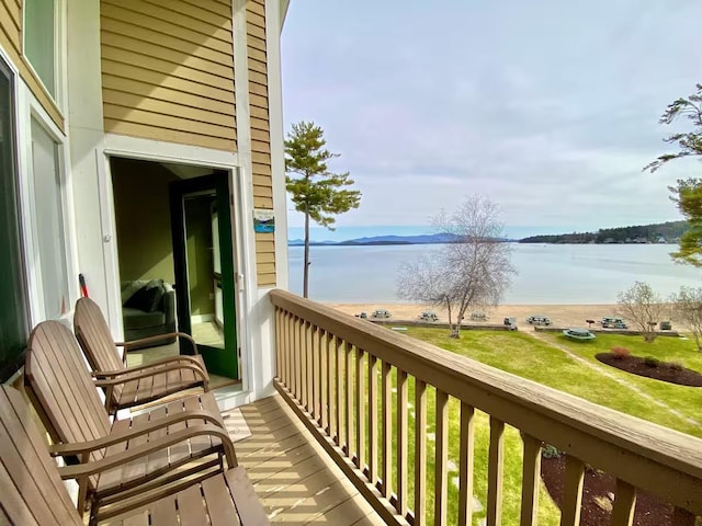 balcony featuring a water view