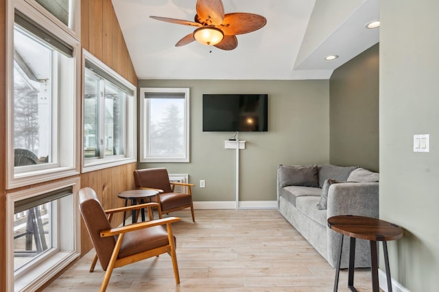 interior space with lofted ceiling, light wood-style flooring, recessed lighting, a ceiling fan, and baseboards