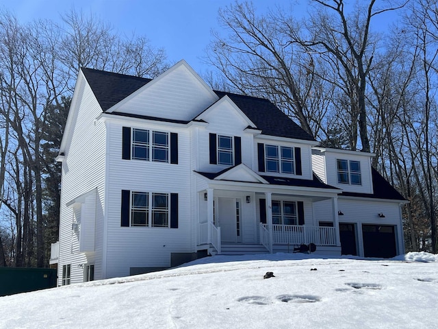 view of front facade featuring a garage and a porch