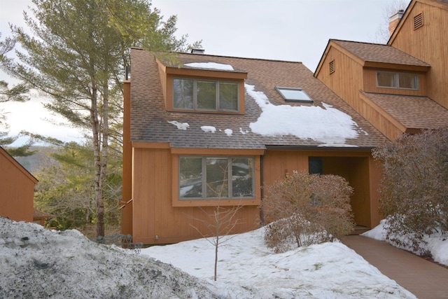 view of front of house with roof with shingles