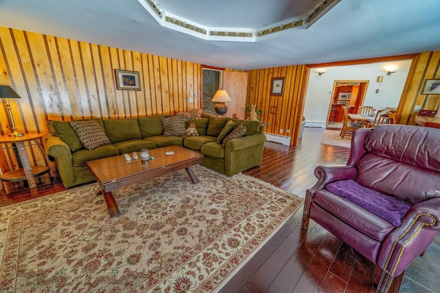 living room with wood walls and wood-type flooring