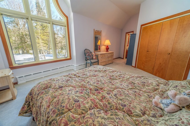 bedroom featuring light carpet, a baseboard radiator, vaulted ceiling, and a closet