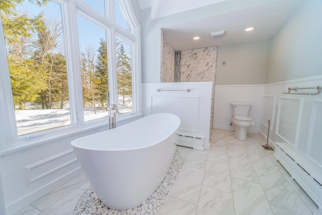 full bathroom featuring a baseboard radiator, marble finish floor, and a wainscoted wall