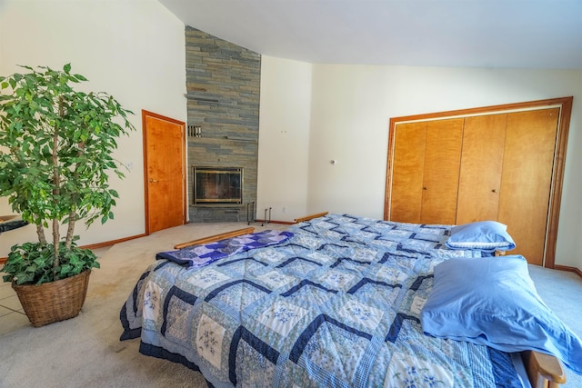 carpeted bedroom with high vaulted ceiling, a stone fireplace, and baseboards