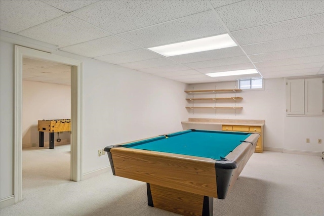 playroom featuring baseboards, a paneled ceiling, and light colored carpet