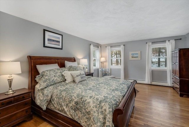 bedroom with wood finished floors