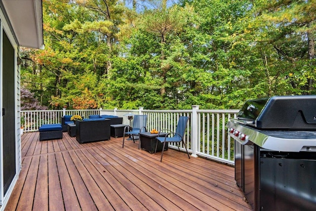 wooden deck with a grill and an outdoor living space